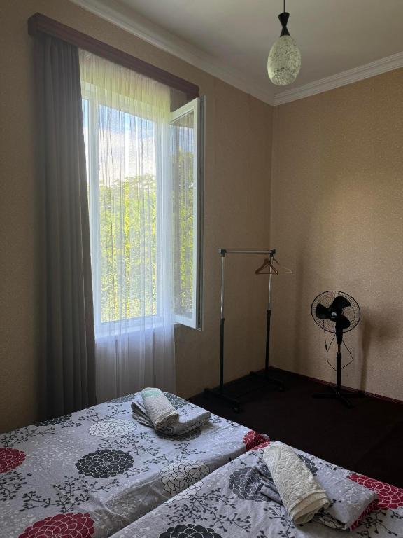 Postel nebo postele na pokoji v ubytování Guest house Gio