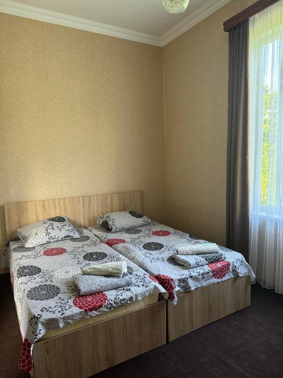 Postel nebo postele na pokoji v ubytování Guest house Gio