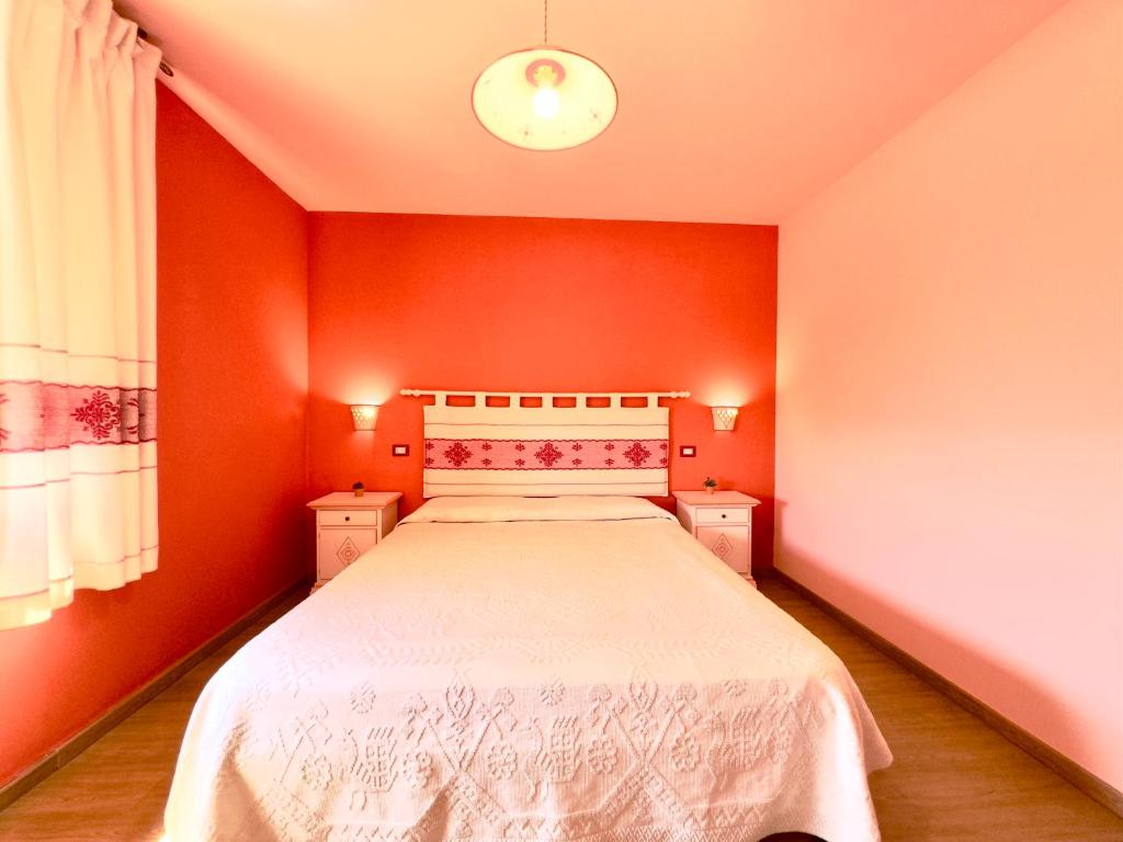 Łóżko lub łóżka w pokoju w obiekcie B&B Selvaggio Blu