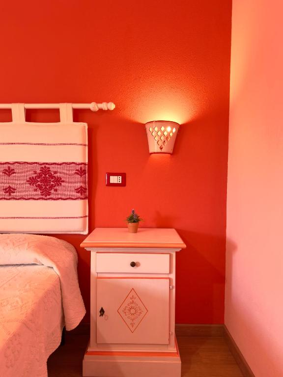 Łóżko lub łóżka w pokoju w obiekcie B&B Selvaggio Blu