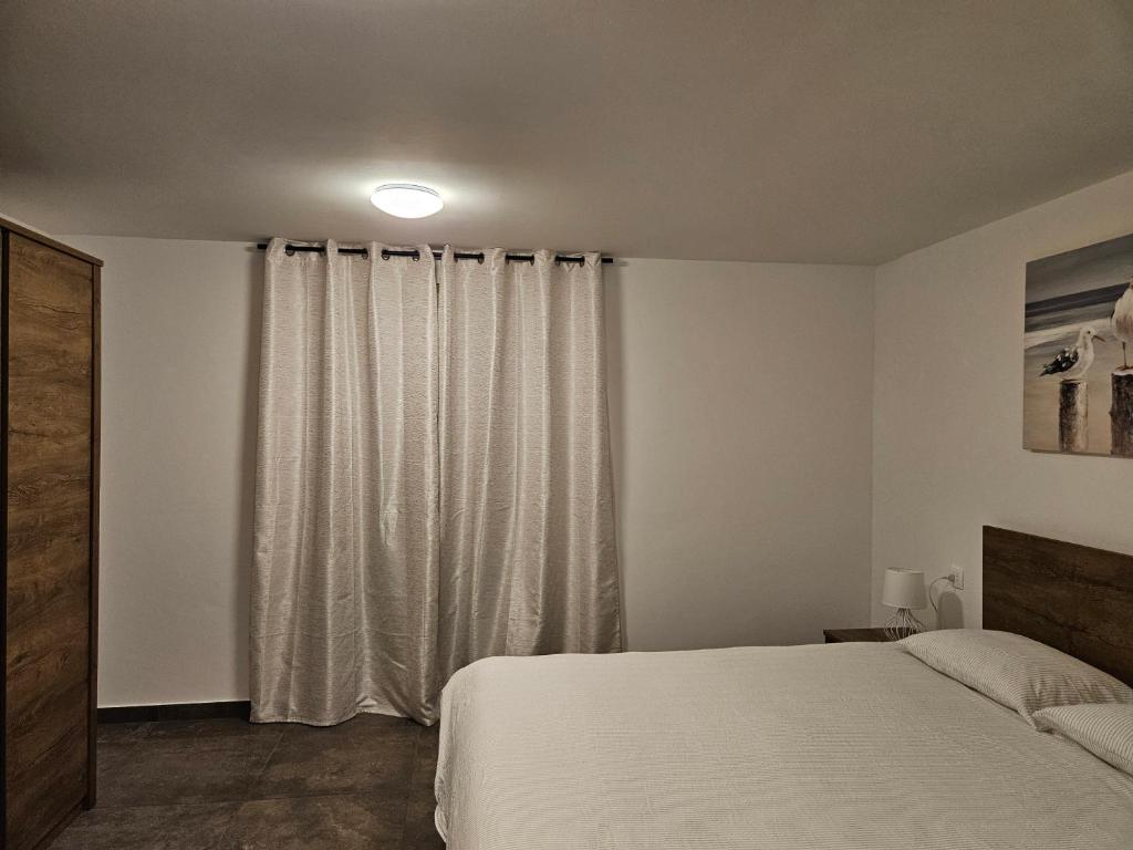 Posteľ alebo postele v izbe v ubytovaní Apartments Brajde