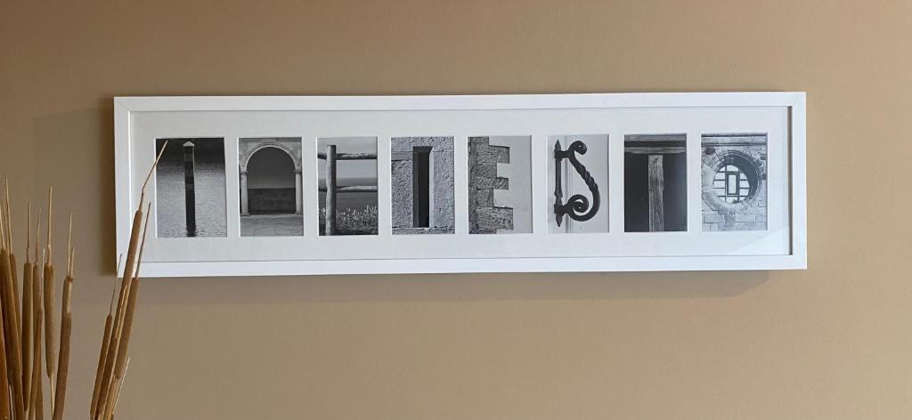 a framed picture of books on a wall at Apartamento en Infiesto Centro in Infiesto
