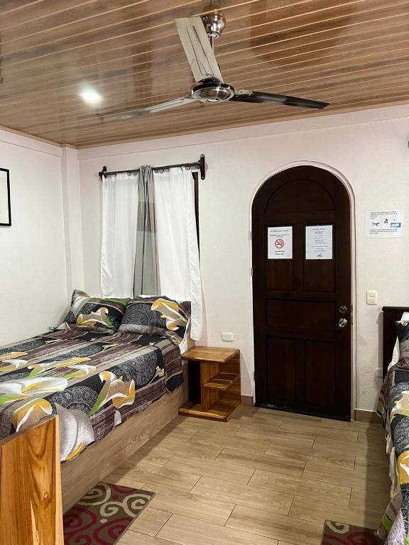 Postel nebo postele na pokoji v ubytování Apartamentos Mansión Tropical