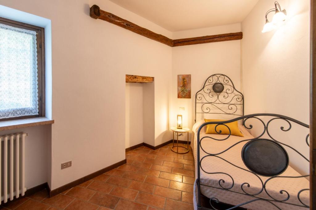 Postel nebo postele na pokoji v ubytování Al Calice