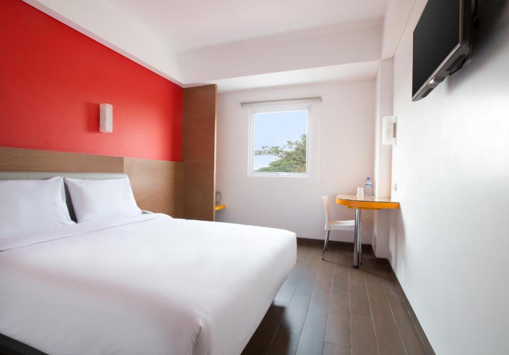 Postel nebo postele na pokoji v ubytování Amaris Hotel Citra Raya – Tangerang