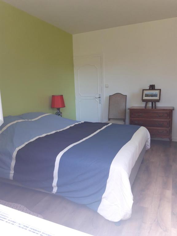 Postel nebo postele na pokoji v ubytování chambre d'hôte