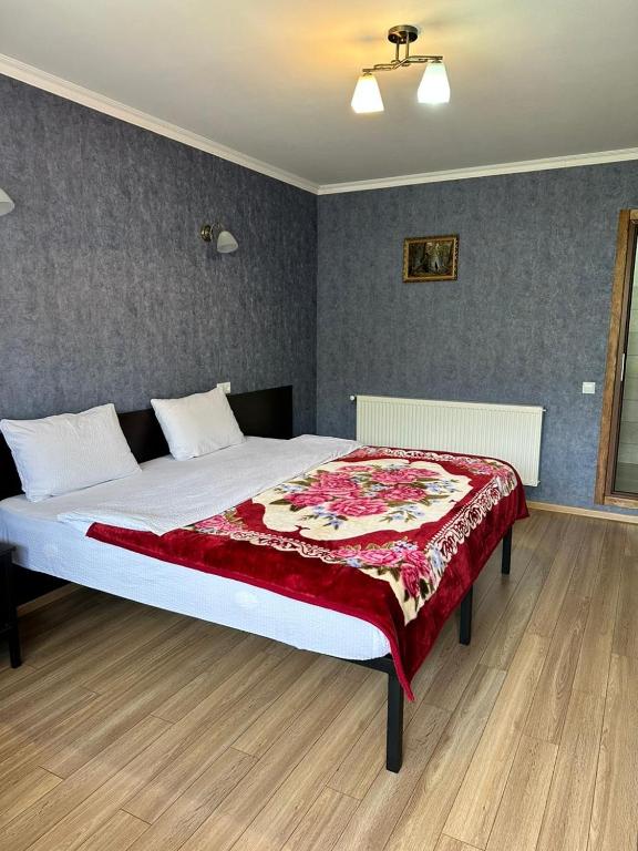 Postel nebo postele na pokoji v ubytování Roza Guesthouse