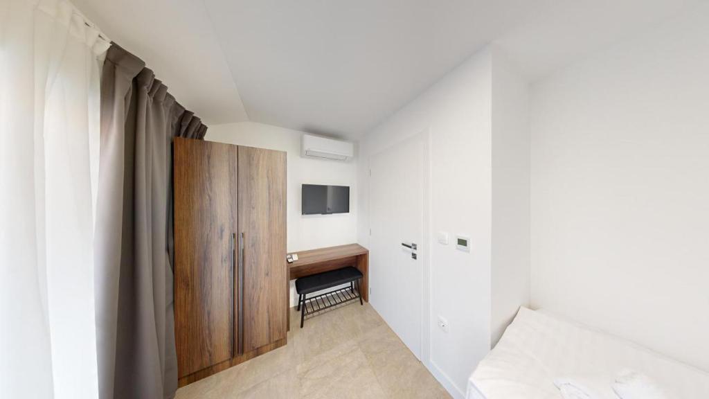 Postel nebo postele na pokoji v ubytování Calypso Residence