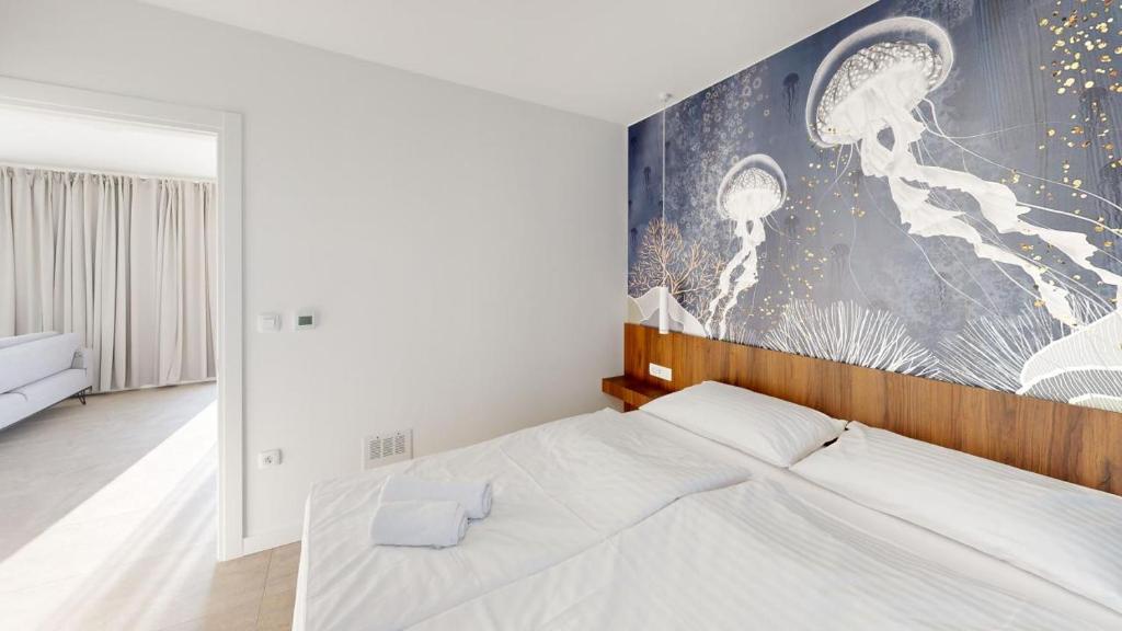 Postel nebo postele na pokoji v ubytování Calypso Residence