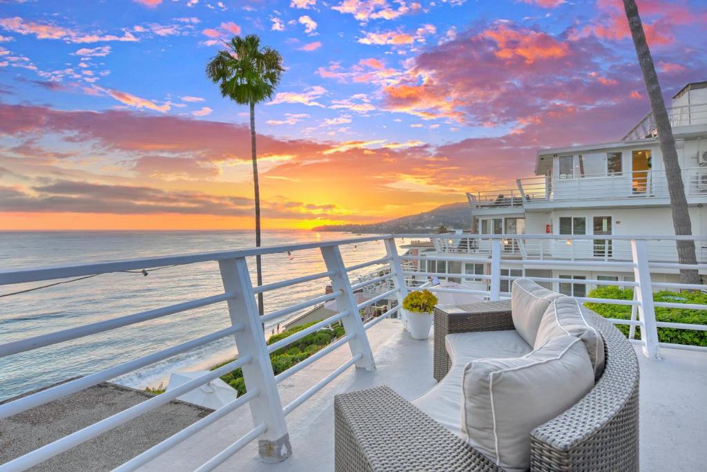 a view of the ocean from the balcony of a house at Laguna Surf Lodge by SCP Hotels in Laguna Beach