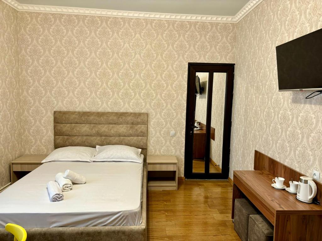 Postel nebo postele na pokoji v ubytování Styopa Hotel
