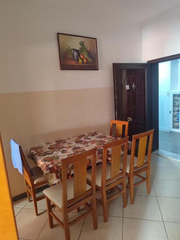 a dining room with a table and chairs at Erald Apartment 2 Bedrooms in Shëngjin