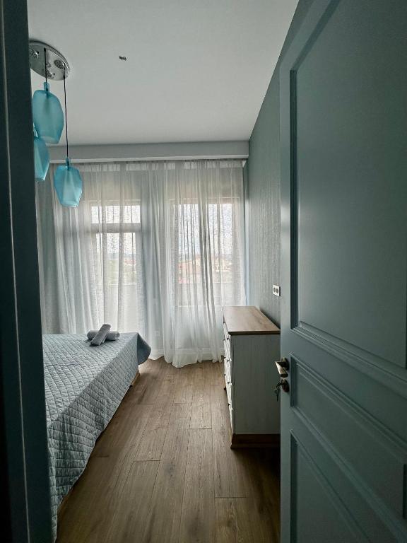 Postel nebo postele na pokoji v ubytování Aparthotel Kutaisi