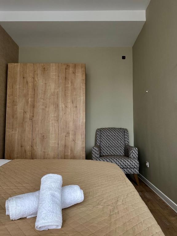 Postel nebo postele na pokoji v ubytování Aparthotel Kutaisi