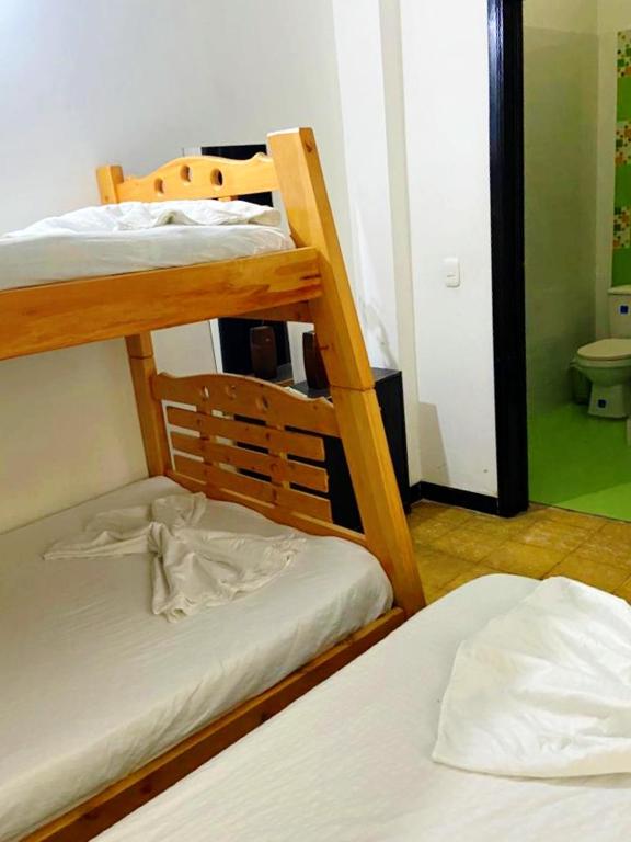 Postel nebo postele na pokoji v ubytování Hospedaje Carmelita Tocaima