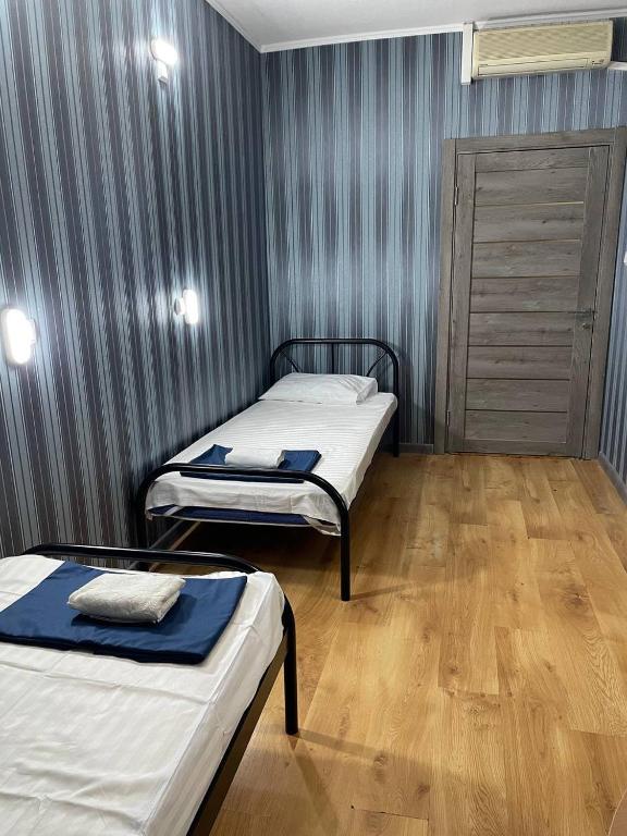 Postel nebo postele na pokoji v ubytování VIP hostel