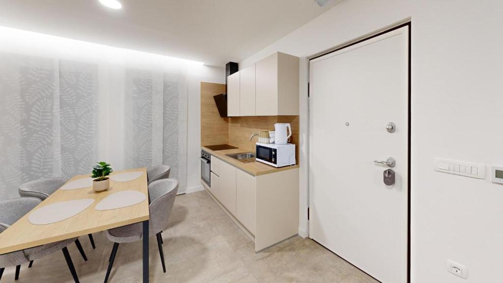 Kuchyň nebo kuchyňský kout v ubytování Calypso Residence