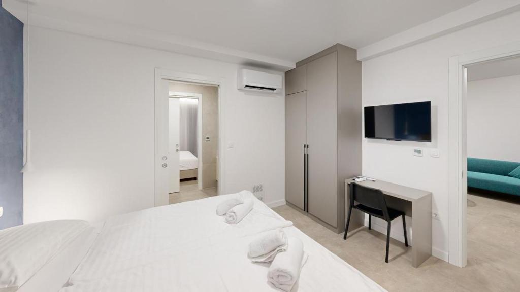 Postel nebo postele na pokoji v ubytování Calypso Residence