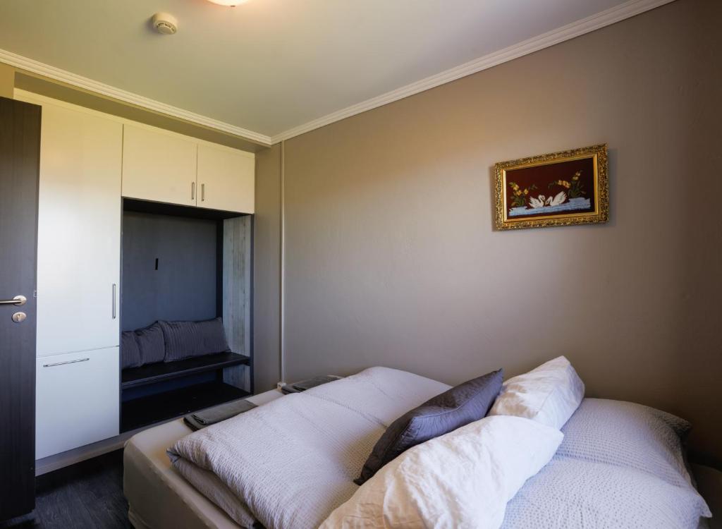 Postel nebo postele na pokoji v ubytování Karuna Guesthouse