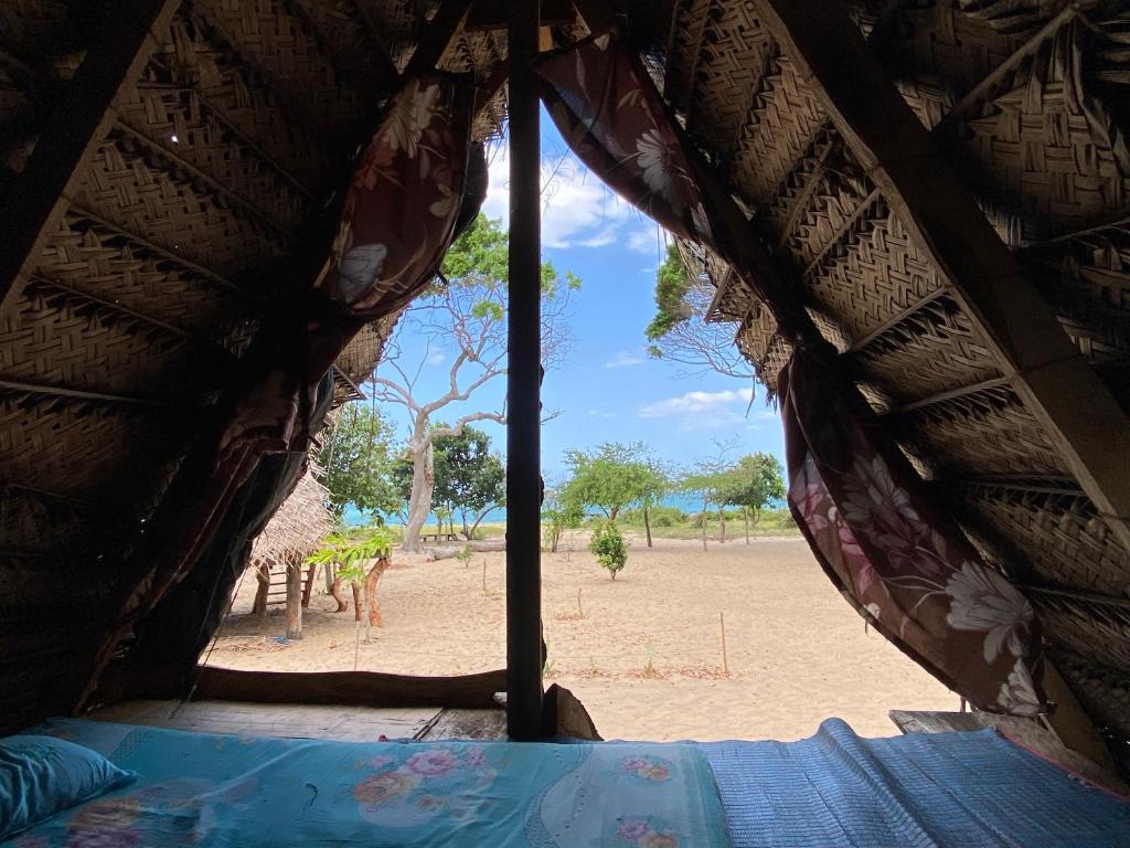 Postel nebo postele na pokoji v ubytování Nilana beach cabana