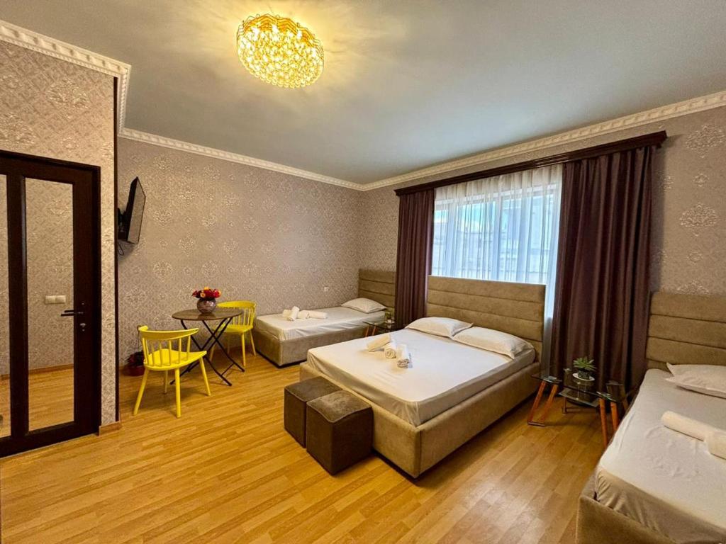 Postel nebo postele na pokoji v ubytování Styopa Hotel