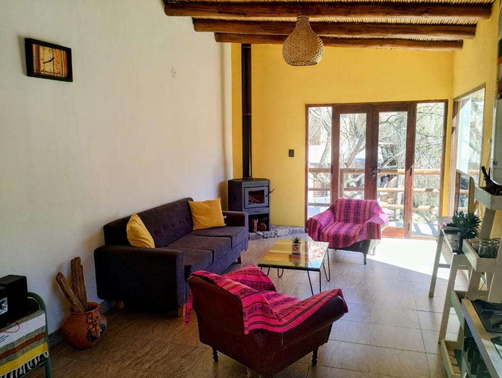 a living room with a couch and a table at Luna Jatun in Purmamarca
