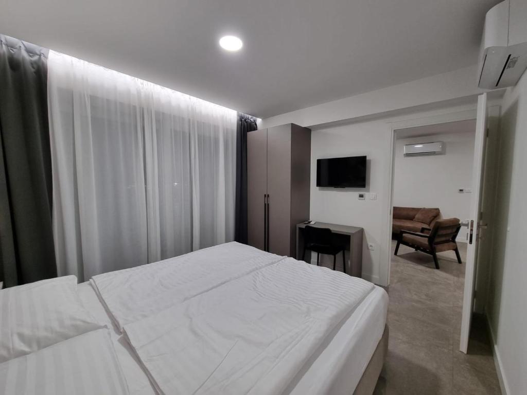 Postel nebo postele na pokoji v ubytování Calypso Residence
