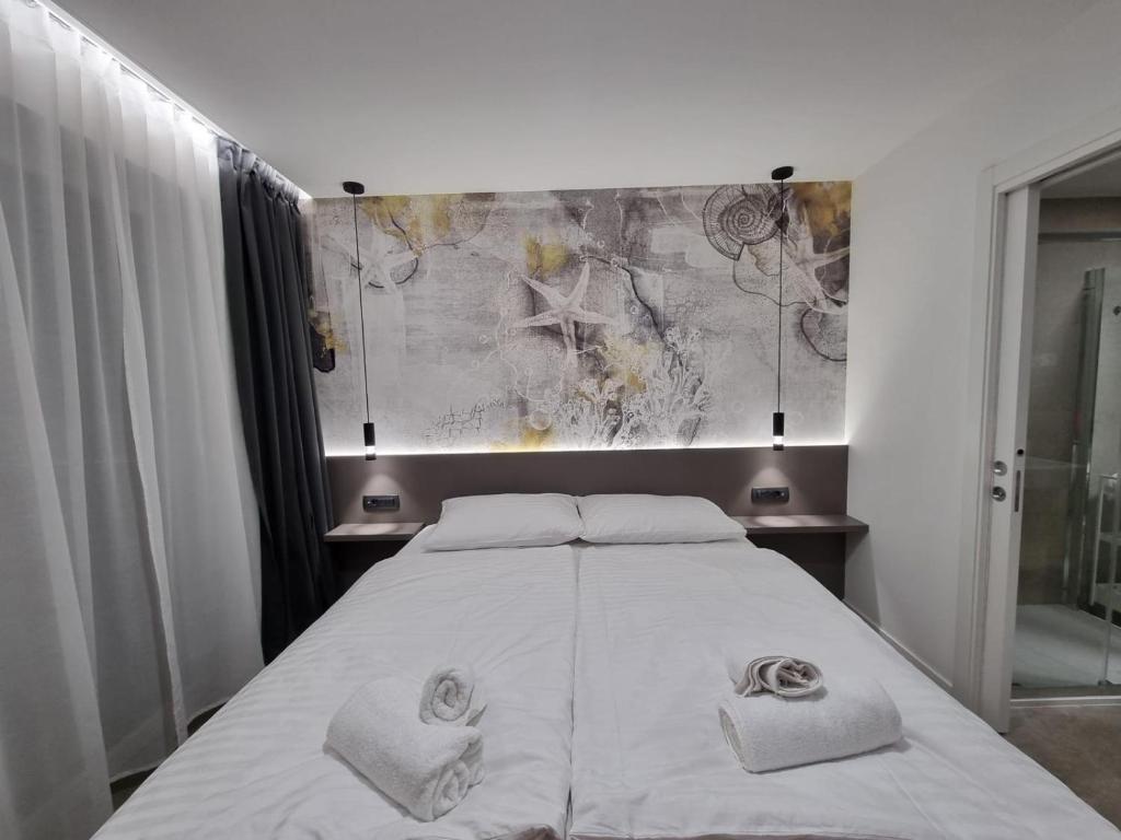 Postel nebo postele na pokoji v ubytování Calypso Residence
