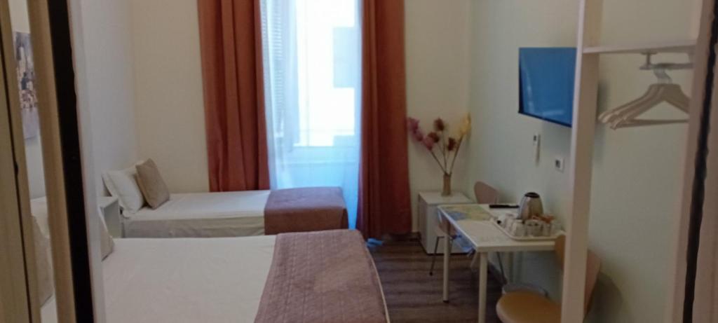 Postel nebo postele na pokoji v ubytování Titi Rooms