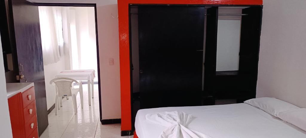 Postel nebo postele na pokoji v ubytování Hospedaje Carmelita Tocaima