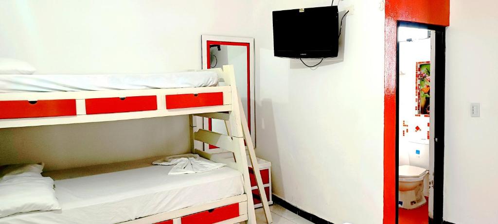 Postel nebo postele na pokoji v ubytování Hospedaje Carmelita Tocaima