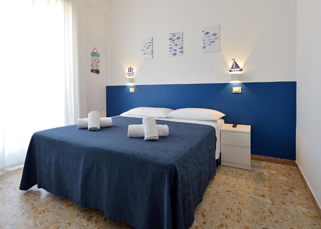 Postel nebo postele na pokoji v ubytování Hotel Oltremar B&B