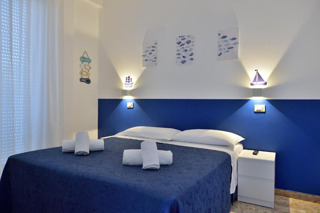 Postel nebo postele na pokoji v ubytování Hotel Oltremar B&B