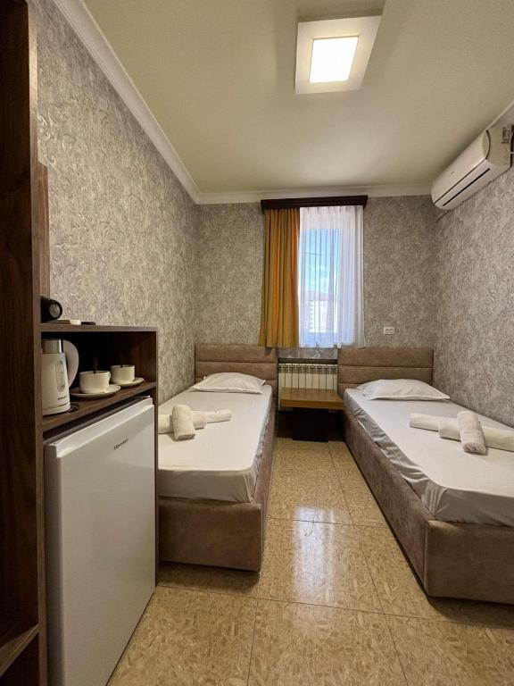 Postel nebo postele na pokoji v ubytování Styopa Hotel