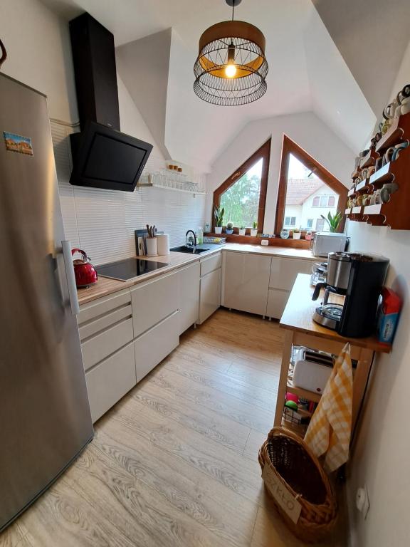 Kuchyň nebo kuchyňský kout v ubytování Bursztynowa 1
