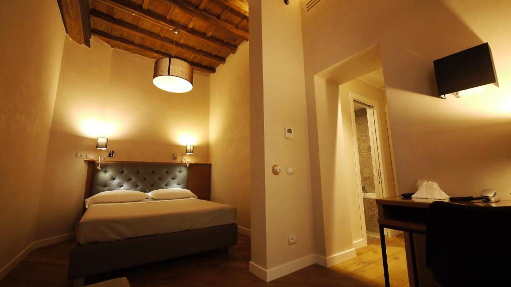Postel nebo postele na pokoji v ubytování Hotel Elite