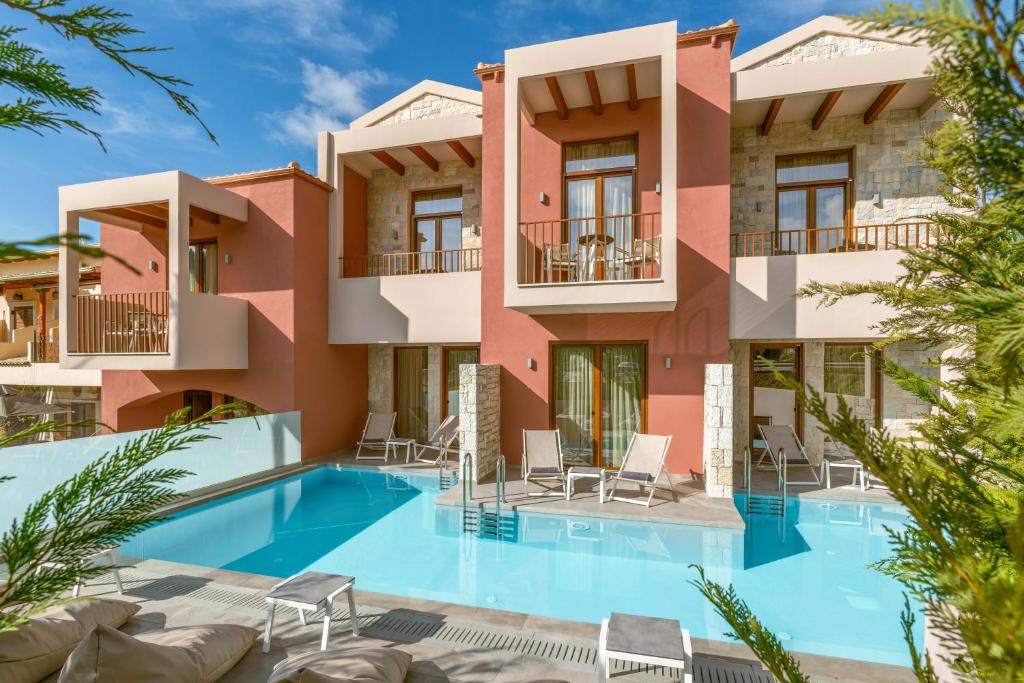 a villa with a swimming pool and a resort at Aria Luxury Residence in Syvota