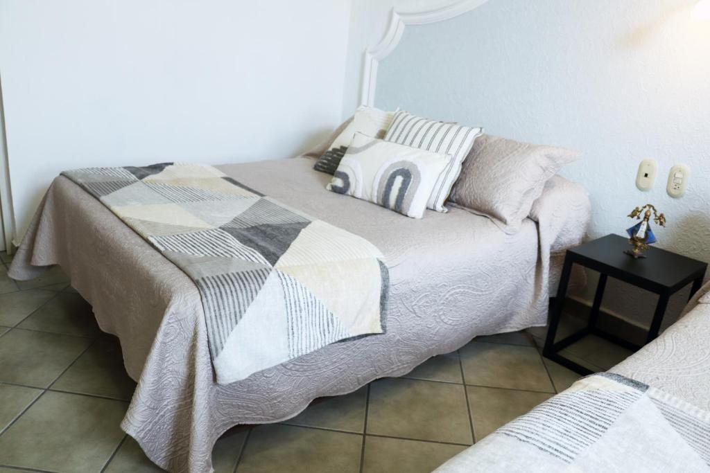 Postel nebo postele na pokoji v ubytování Hotel Plaza San Juan
