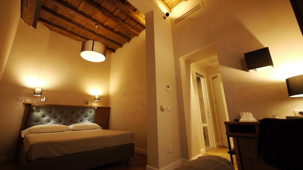 Postel nebo postele na pokoji v ubytování Hotel Elite