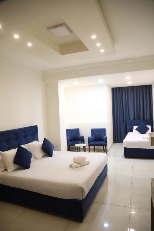 Postel nebo postele na pokoji v ubytování Orient Prince Hotel