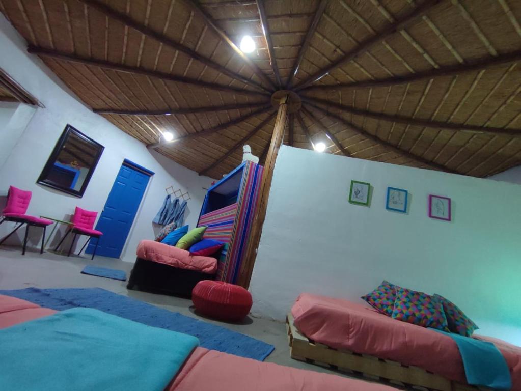 a room with a tent with a bed and chairs at Villarica Atacama - Antigua Cabanas Rica Rica in San Pedro de Atacama