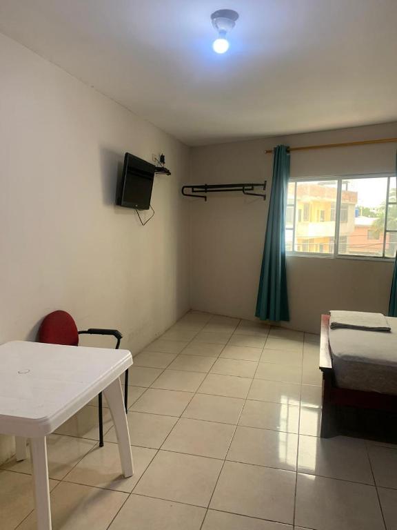 TV a/nebo společenská místnost v ubytování Habitaciones amobladas - Manabí suites