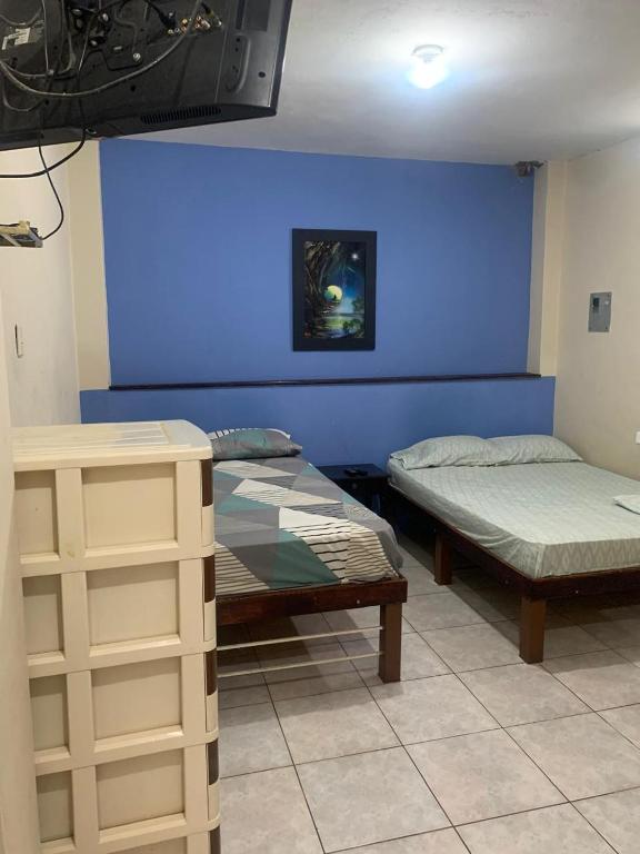 Postel nebo postele na pokoji v ubytování Habitaciones amobladas - Manabí suites