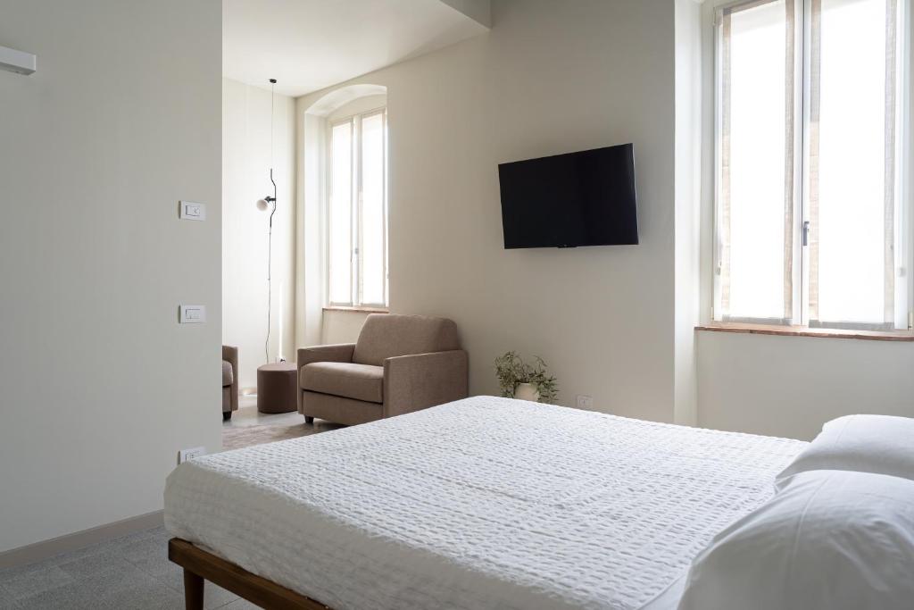 TV a/nebo společenská místnost v ubytování The Lake Suites com - Luxury stay in Lazise