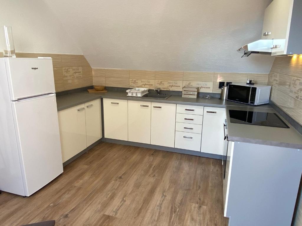 Kuchyň nebo kuchyňský kout v ubytování M3-Apartmány