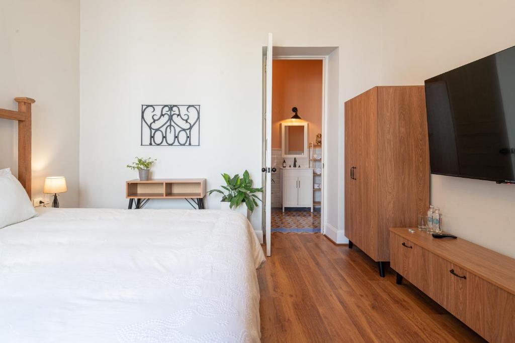 Postel nebo postele na pokoji v ubytování Casa Cáceres