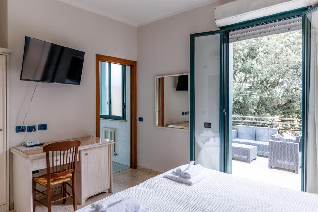 Postel nebo postele na pokoji v ubytování Hotel Classicano