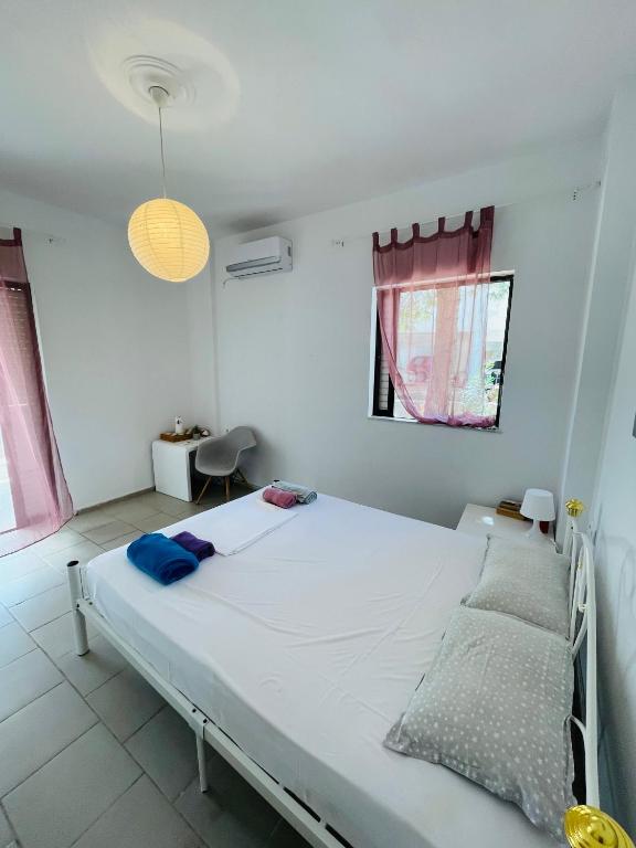 Postel nebo postele na pokoji v ubytování akrata siesta