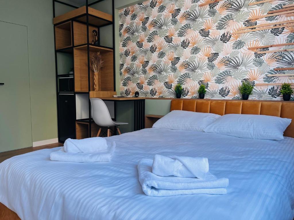 Postel nebo postele na pokoji v ubytování Moxa Residence