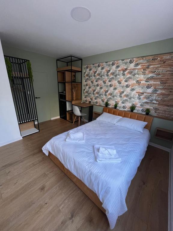 Postel nebo postele na pokoji v ubytování Moxa Residence